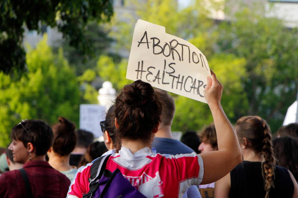 A protester outside the U.S. Supreme Court after a draft of a decision to overturn Roe v. Wade leaked in May 2022.
