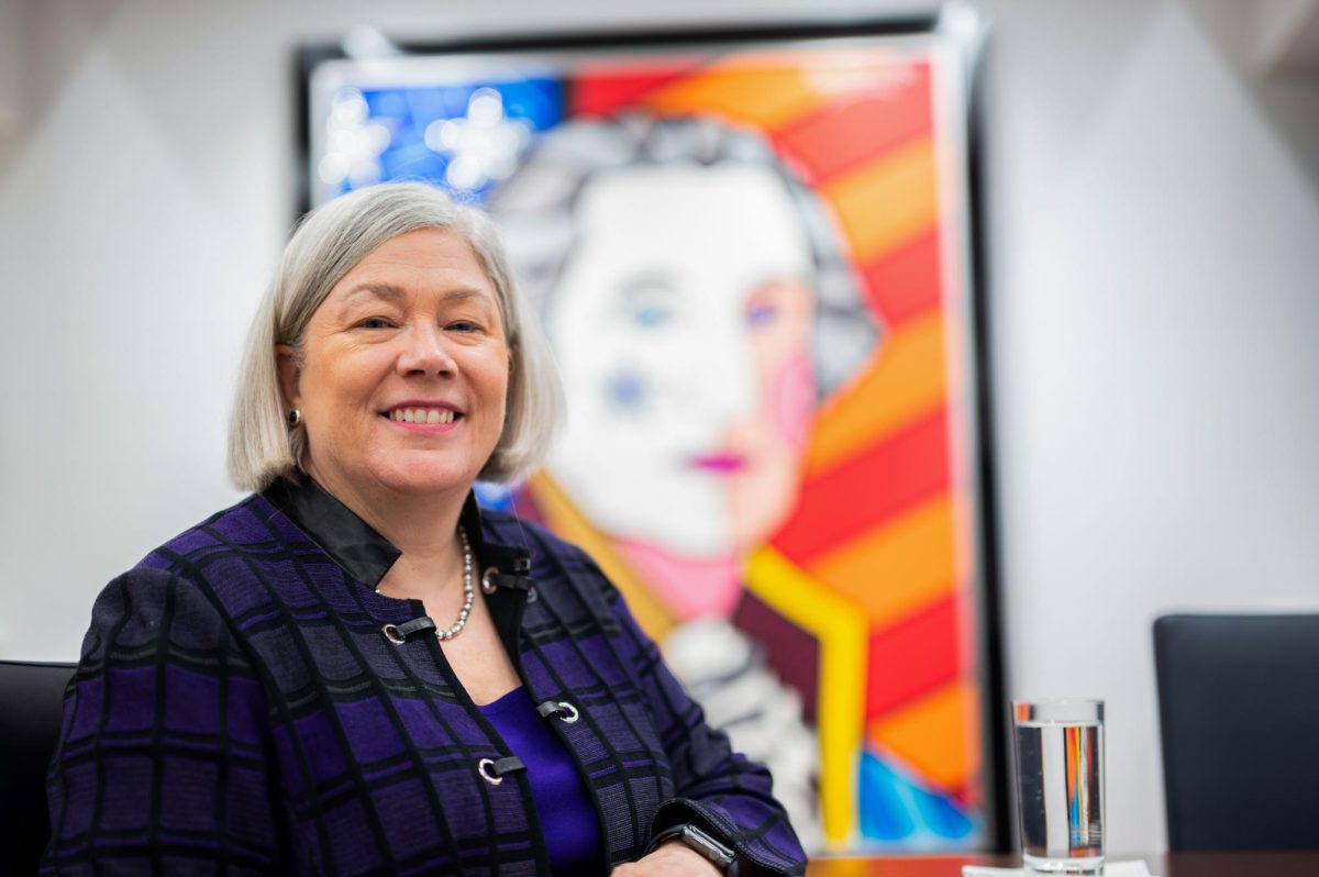 University President Ellen Granberg smiles in her office at 1918 F Street