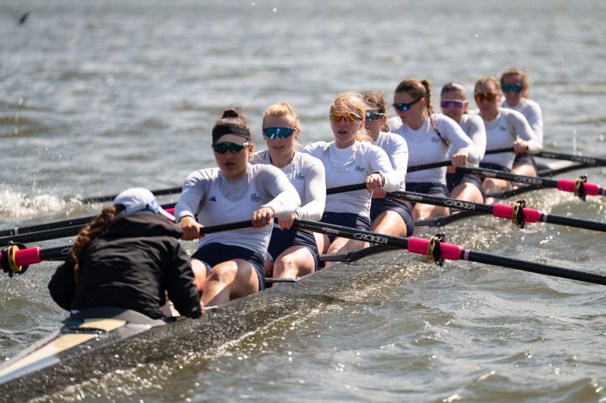 The first varsity eight boat races in the GW Invite in April.