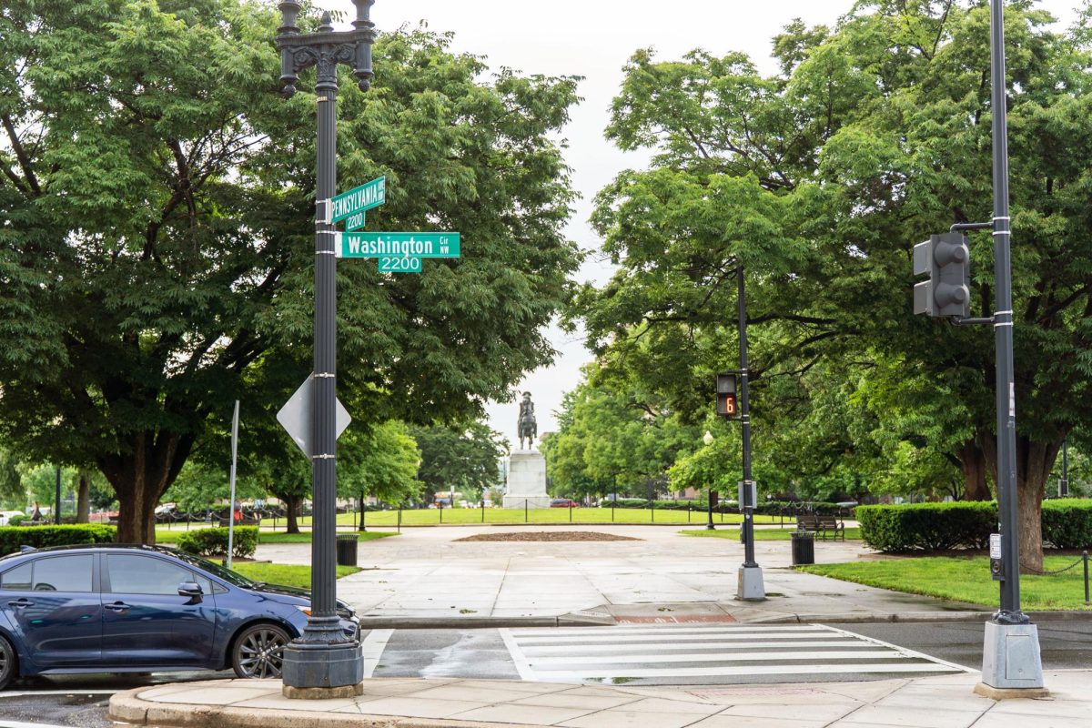 A car drives through Washington Circle.